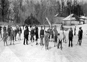 A bunch of young boys play ice hockey in the cold on a pond at St. Joseph’s Normal Institute in Pocantico Hills, New York. 